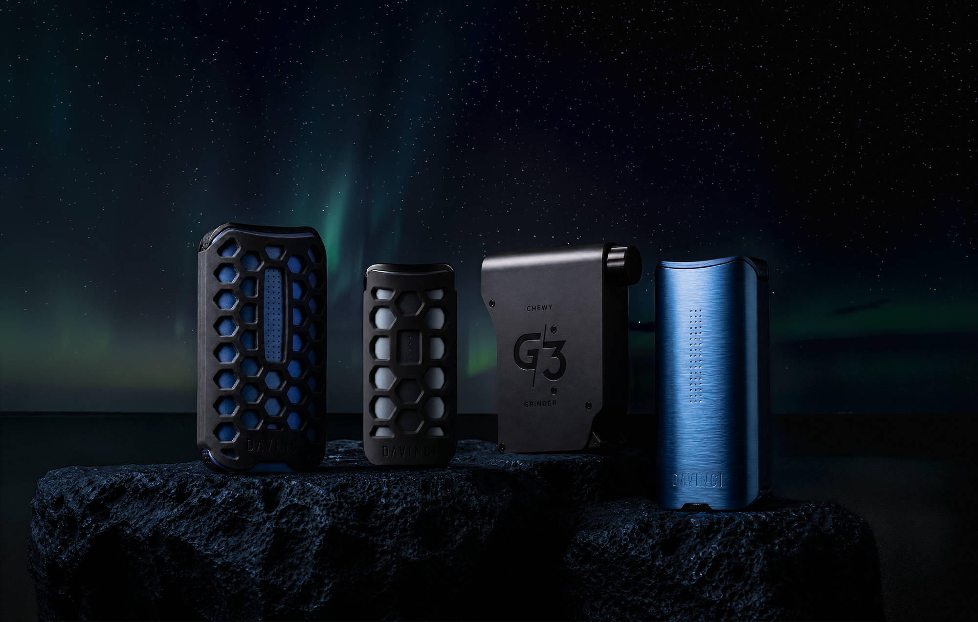 DaVinci vaporizer lineup on volcanic rock under an aurora sky